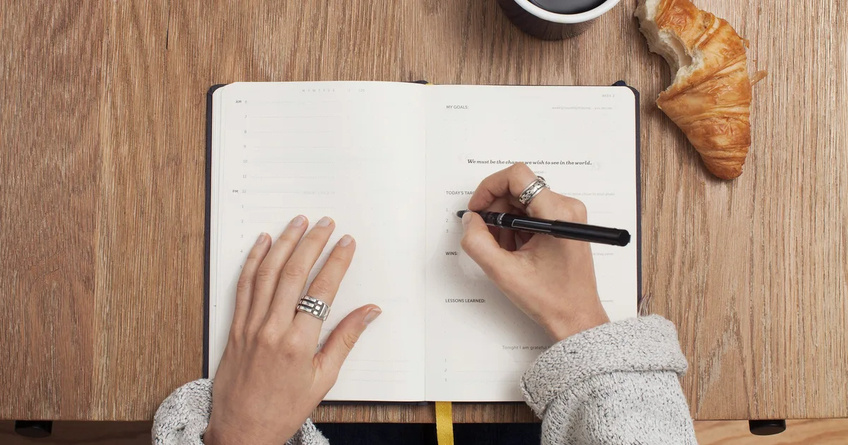Australian small-business owner reviewing a bookkeeping checklist and source documents